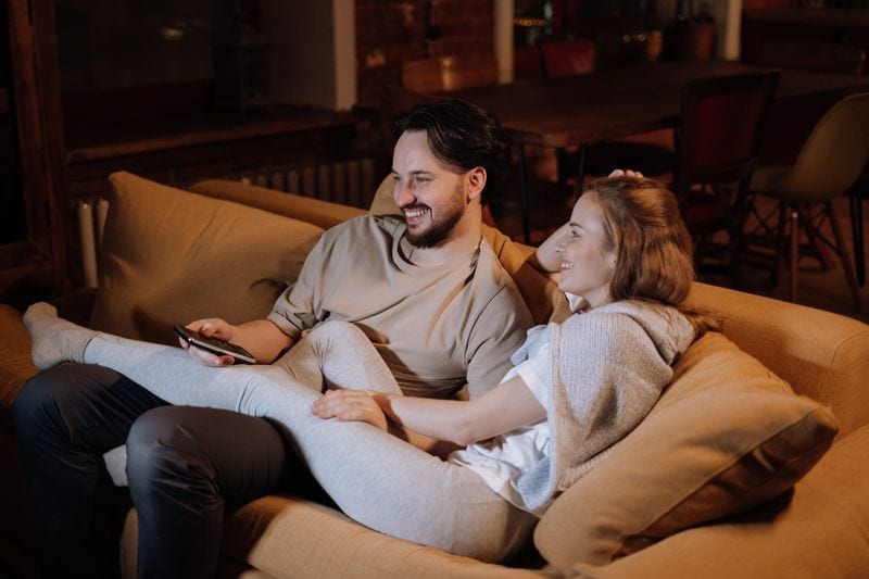 Man and Woman on couch grasshopper position