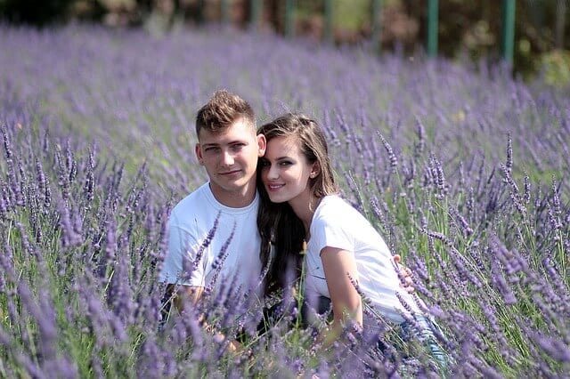 couple sitting in lavender meadow