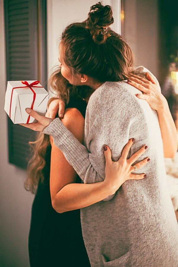 Girl giving a present to a girl
