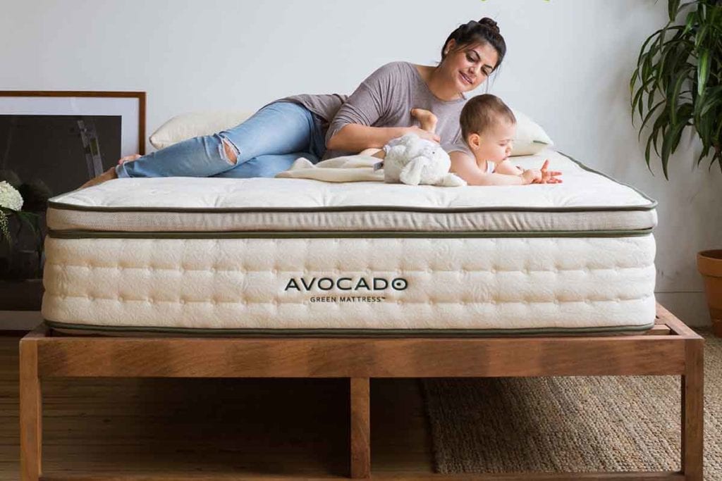 Mom with baby lying on the AVOCADO GREEN MATTRESS