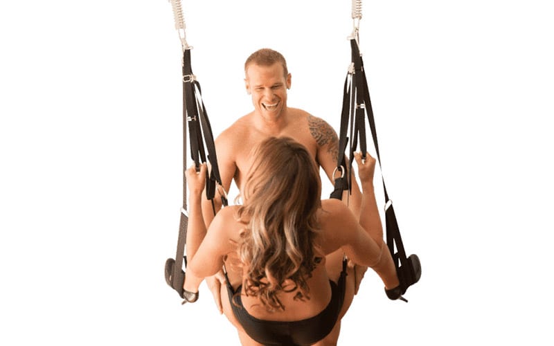 Couple play on the Screamer Sex Swing Dual Hook