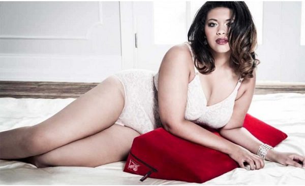 plus size woman in underwear with sex pillow