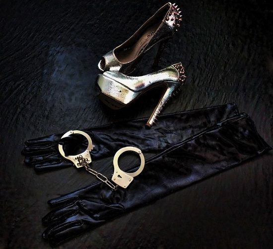 High heels, handcuffs and black gloves