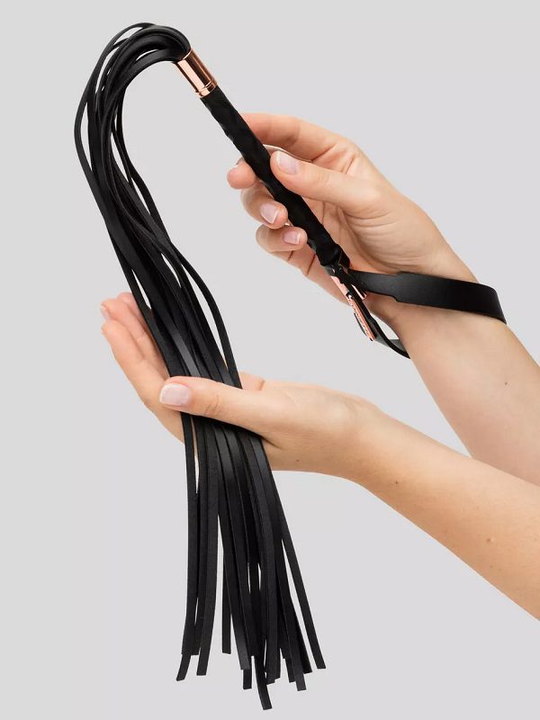 Coquette Premium Faux Leather Flogger in hands