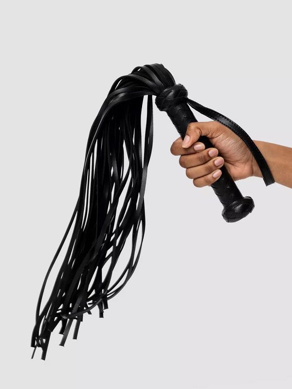 Fifty Shades of Grey Bound to You Faux Leather Flogger in a hand